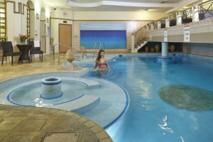 Girl entering Aquilla indoor swimming pool