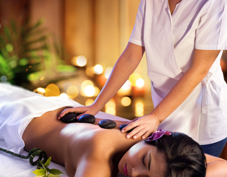 Spa Treatment - Masseur With Hot Stones